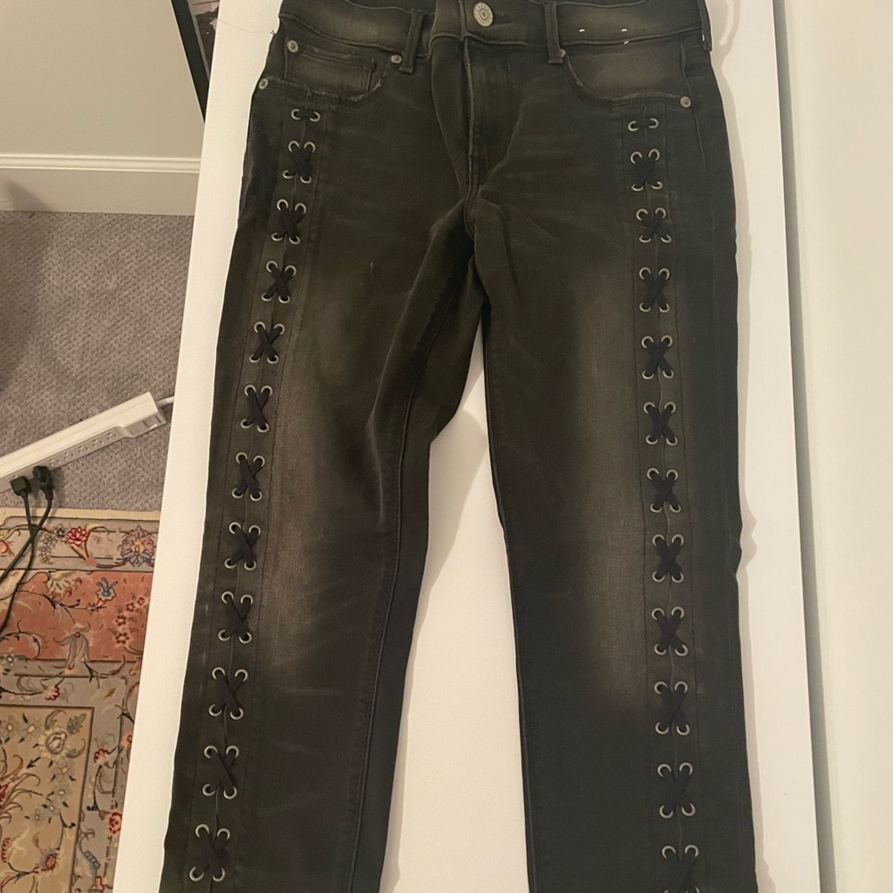 Express black denim with lace up detail on side